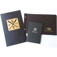 Custom Turned Edge Hard Covers featuring stylish designs for menus and presentation booklets, including embossed logos, foil stamping, and wood inlay accents.