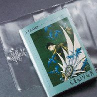 A graphic novel is partially inserted into clear Adjustable Book Covers, showing the protective plastic sleeve designed to fit various book sizes.