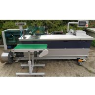 The CB40B Automatic Plastic Coil Binding Machine includes a large coil feeder, integrated conveyor, and control panel for efficient high-volume coil insertion and crimping in document production workflows.