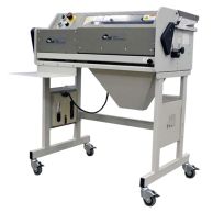 A James Burn CB30QS Automatic Coil Inserter & Crimper, an industrial binding machine with a protective cover, control panel, coil insertion system, and crimping mechanism, is mounted on a wheeled metal stand with a side table and an attached power cord ma