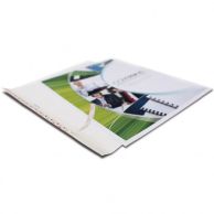 A partially open document with a custom printed cover is prepared for binding using Coverbind Design On-Demand Thermal Binding Covers, featuring an adhesive spine for secure document assembly.