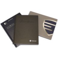 Three Custom Coverbind Hardcovers for Thermal Binding are shown in assorted colors and finishes, each featuring unique branding including embossed and printed logos.