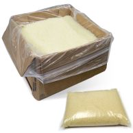 A large cardboard box lined with plastic holds loose granules of Coverbind Perfect Bind Adhesive – Premium, with a smaller sealed bag of the same adhesive granules placed nearby for convenient use.