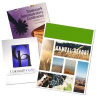 Custom Full-Color Coated Paper Report Covers featuring detailed designs, including conference branding, company logos, and annual report visuals with high-resolution images.