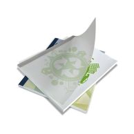A stack of eco-themed documents bound with Coverbind Black Eco Linen Thermal Binding Covers shows clear front covers and black linen-textured spines, with one cover partially lifted to reveal printed content inside.