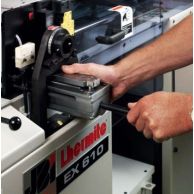 A person inserts a die unit into the side of a James Burn Lhermite EX610 machine, demonstrating installation of Punching Dies for James Burn EX610 Automatic Punch.