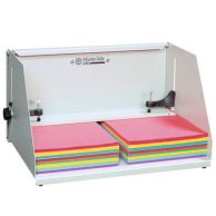 The Martin Yale J1811 Padding Press shown securing stacks of multi-colored paper.