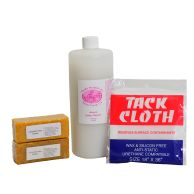 A set of laminator cleaning supplies including two glue erasers, a bottle of roller cleaner, and a tack cloth.