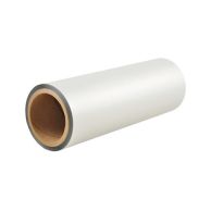 A roll of LuxeFilms Karess Soft Touch Matte Commercial Laminating Film is shown with a smooth, velvety matte finish and a thick cardboard core.