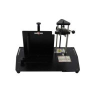 The PAL-M Piks-A-Lift Manual Paper Picker is shown from the front, featuring adjustable metal guides, a vertical support plate, and a triangular paper alignment tool mounted on a black base.