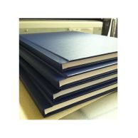A stack of professionally bound documents features sturdy Velobind Black Hard Covers with crisp edges and a clean, squared spine for a formal presentation.