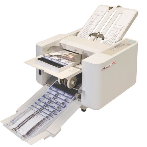 MBM 208J Friction Fed Paper Folder in use, shown processing full-color brochures through its automatic feeding, folding, and output trays.