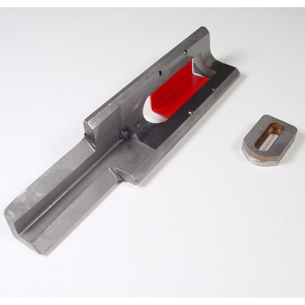 A metal tool with a rectangular cutout and a smaller component beside it, labeled "Akiles Diamond 5 Dies & Accessories."