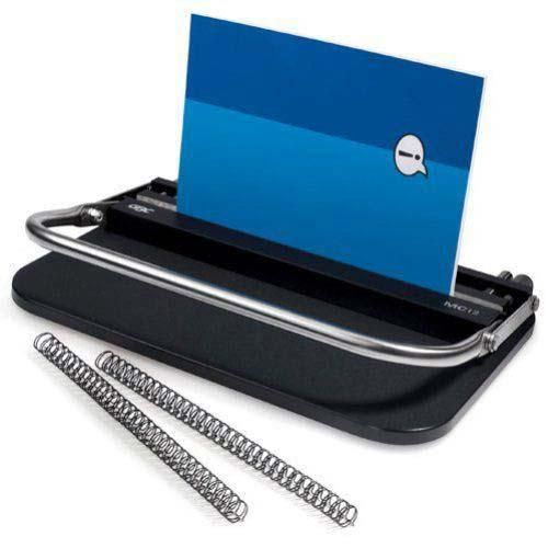 The GBC MC-12 Wire Closer is a compact manual wire binding machine featuring a sturdy metal bar for closing twin-loop wire bindings, a sleek black base for stability, and an open document positioned for binding alongside two Wire-O® spines.