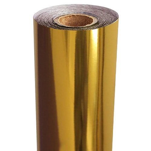 
A roll of bright gold metallic foil stands upright, with a brown core visible at the top.