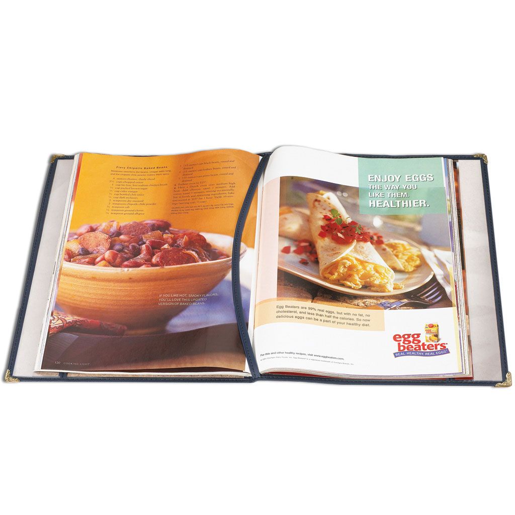 An open cookbook is protected by clear plastic magazine covers with reinforced edges and corner protectors.