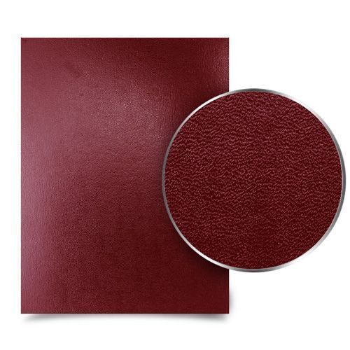 A single sheet of Sedona Maroon Premium 17pt Vinyl Report Covers is shown with a close-up circle highlighting the textured, leather-like finish of the durable maroon surface.