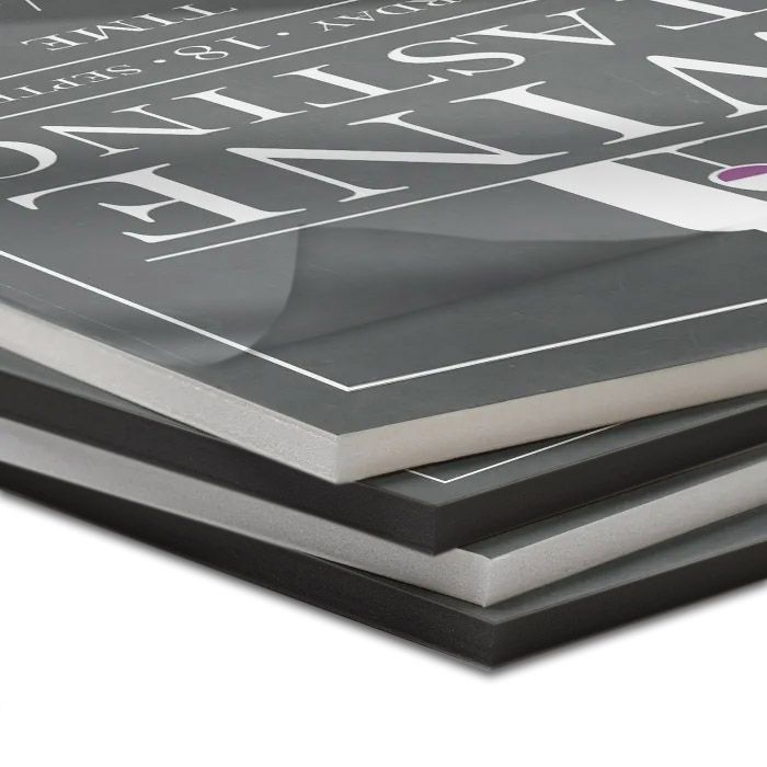 Stacked Thermal Foam Core Pouch Boards with Matte Laminate featuring a soft, non-reflective surface over printed graphics and both black and white foam core options.