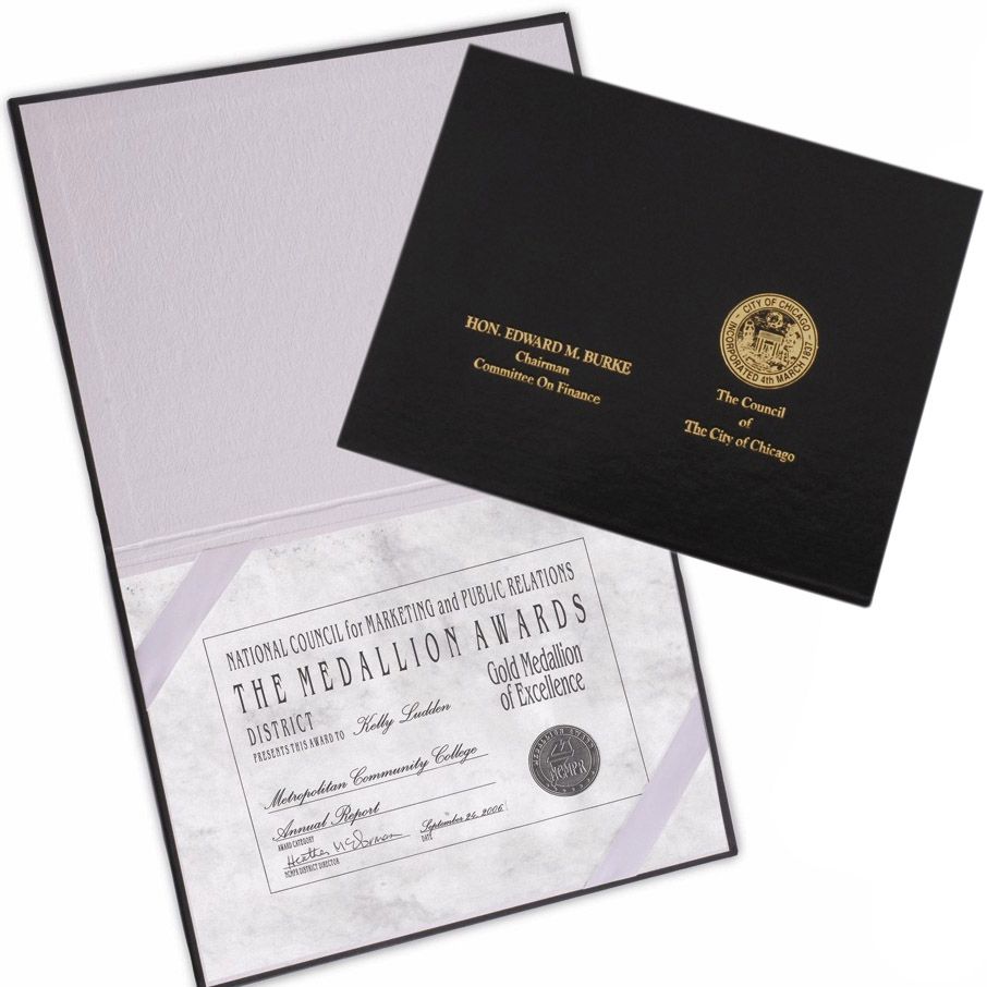 Custom Hardcover Certificate Holders featuring a textured black exterior with gold foil stamping and an interior with corner ribbons to securely display a formal award certificate.