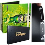 Custom binding products for business including a Heineken-themed binder, a black ledger, and tabbed dividers.