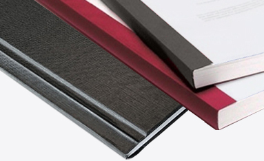 Three Coverbind thermal bound books in black, red, and white, showcasing their professional binding styles.