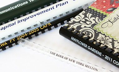 A plastic comb bound documents showcasing custom printed binding combs