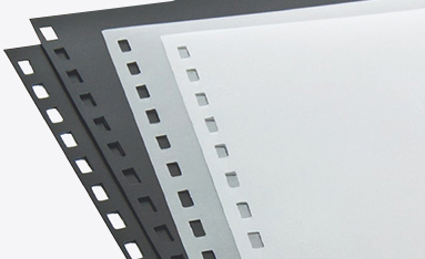 Four sheets of pre-punched paper and covers in varying shades of grey and white.