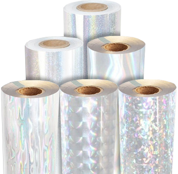 Rolls of transparent foils with various holographic patterns, reflecting light in iridescent colors.