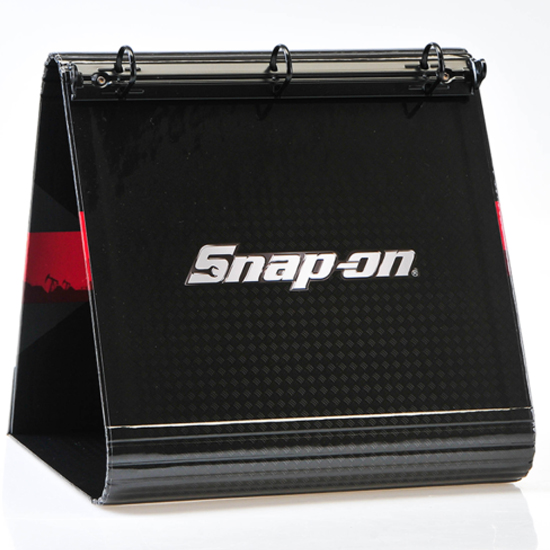 Black custom easel binder with Snap-on logo and three-ring mechanism.